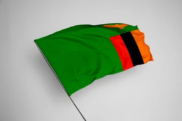 Foto op Aluminium Zambia flag isolated on white background. close up waving flag of Zambia. flag symbols of Zambia. Concept of Zambia. © Tatoh