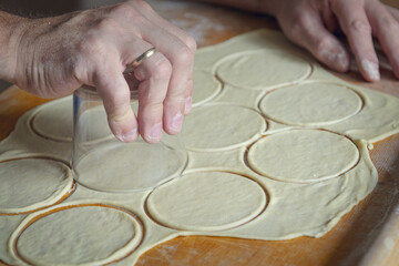 Fototapeta na wymiar Making dumplings or pierogi
