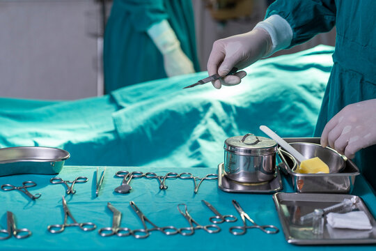 Preparing Surgical Instruments, Scissors, Doctor's Hand, Wearing Surgical Gloves In The Hospital Operating Room 