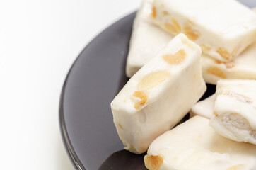 Traditional confections made with sugar or honey, roasted nuts and whipped egg whites