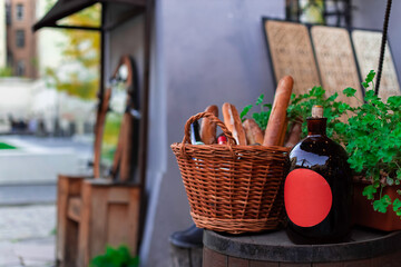 baguette and wine still life restaurant food photography outdoors patio space decoration view with empty copy space on bottle soft focus concept on cork