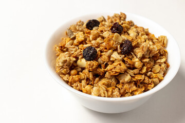 muesli in a white bowl. healthy food