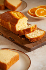 Slices of homemade cake with oragnic oranges