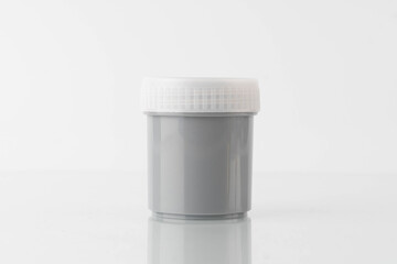 Stool container sterile sample specimen bottle on white background. Fecal analysis to help diagnose conditions included infection (virus, bacteria, parasites), poor nutrient absorption, or cancer.