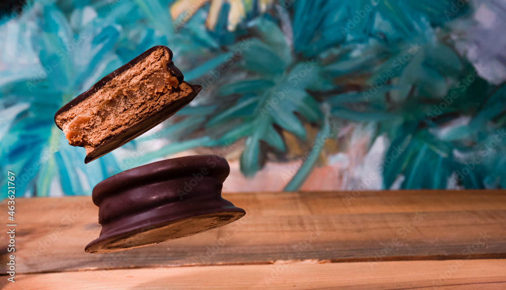 Poster Closeup shot of floating Argentine alfajor on a table