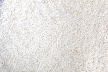 Close up of grains of jasmine rice on background.