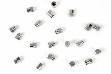 Fototapeta premium cap shiny on the valve of a wheel of a car made of silver metal. close-up. abstract background