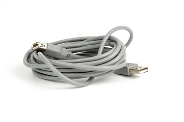 connecting cord for USB connectors of a personal computer coiled into a tight coil. copy space