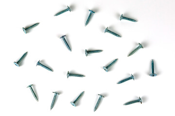 abstract background. shiny self-tapping screws for metal on a white background