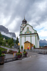 Fototapeta na wymiar Church in the center of San Cassiano, Dolomites