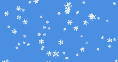 Glowing snow particles falling against blue background