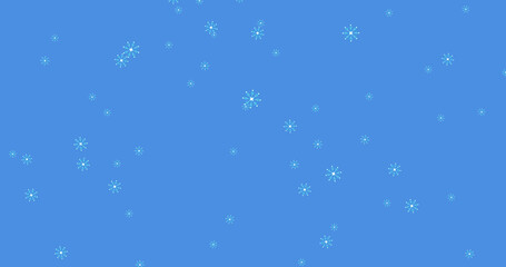 Glowing snow particles falling against blue background