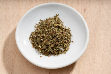 Detailed and large close up shot of lovage on a small plate