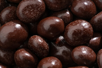 Detailed and large close up shot of chocolate covered coffee beans