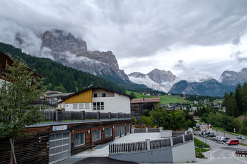 Fototapeta na wymiar Corvara - August 2020: view of the center of San Cassiano with Dolomiti on the background