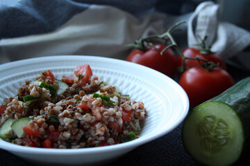 Salad of buckwheat, tomatoes, cucumbers and dill.