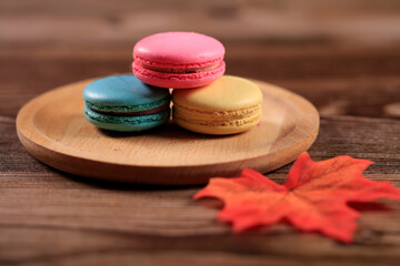 The macarons are on wooden plates