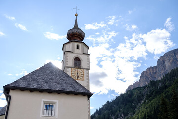 Fototapeta na wymiar Corvara - August: Church St. Vigilius in Colfosco, Dolomites, Italy