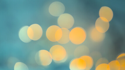 Abstract background with orange bokeh on an azure background. Defocused. Blurred. © SaNataPhoto