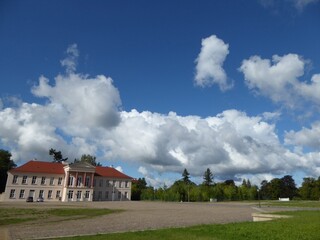 Fototapeta na wymiar Cloudscape over a square in Neustrelitz, Mecklenburg-Western Pomerania, Germany , on the left the 