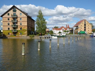 Historical warehouses converted into residential buildings at the city harbor of Neustrelitz, Mecklenburg-Western Pomerania, Germany