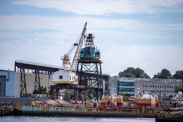 Fototapeta premium A view of the Brooklyn Navy Yard from the East River in New York City