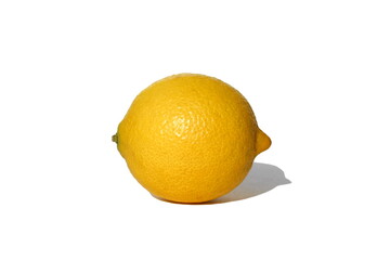 Ripe juicy yellow lemon lies on a white isolated background.