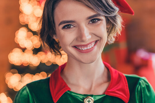 Photo of charming pretty young lady wear elf clothes celebrating christmas smiling indoors house home room