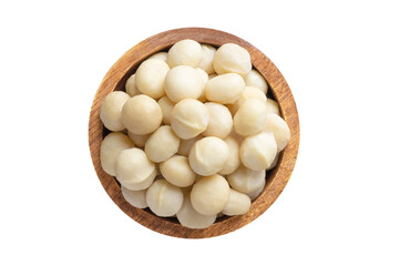 macadamia nuts peeled in wooden bowl isolated on white background. Vegan food, top view.
