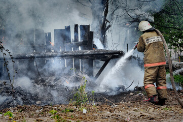 Firefighters with the inscription on the back in Russian 