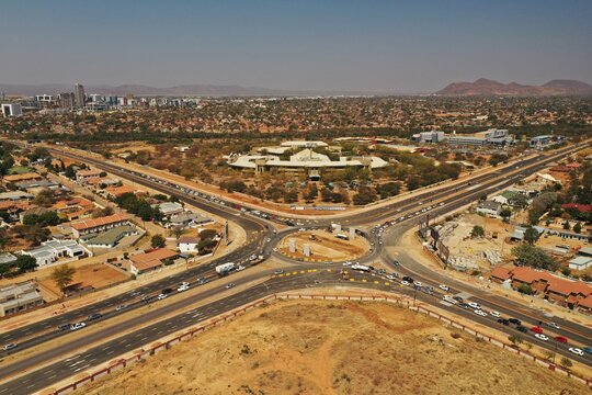 Flyover traffic bridge construction on the western bypass in Gaborone, Botswana, Africa. Also visible is the Mass Media complex