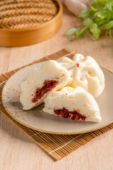 Baozi or Bakpao is a type of yeast-leavened filled bun in various Chinese cuisines. There are many variations in fillings (meat, chocolate) and preparations, though the buns are most often steamed.