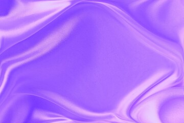 Purple satin background. Silk fabric with pleats. Satin, silk or satin creates a beautiful drape. Fashion design.