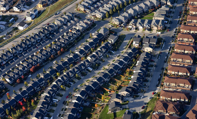Residential Homes in Maple Ridge City in Greater Vancouver, British Columbia, Canada. Aerial View from Airplane. Sunny Fall Season.