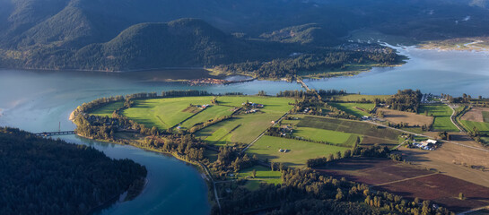 Aerial View of Fraser Valley with Canadian Nature Mountain Landscape Background. Harrison Mills near Chilliwack, British Columbia, Canada.