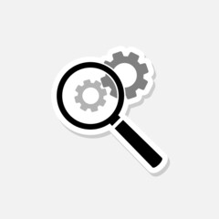 Gear and magnifying glass sticker icon