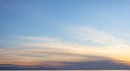 View of colorful cloudscape during vibrant summer sunset on the ocean coast. Taken in Vancouver, British Columbia, Canada. Nature Background