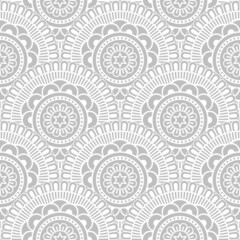 Abstract seamless mandala background. Texture in soft gray and white colors. Oriental pattern for design, fashion print, scrapbooking	