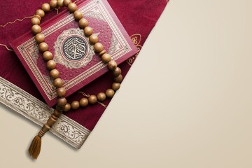 Holy Quran book with arabic calligraphies translation and Rosary beads