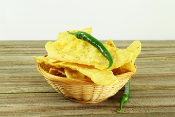 traditional indian gujarati snack food fafda with chilli in bamboo basket 