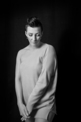 Black and white portrait of a beautiful woman with a short haircut mohawk emotions mood