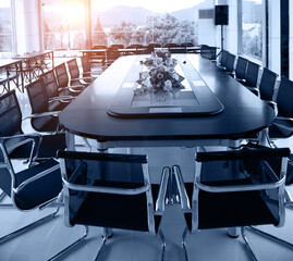Conference table and chairs in meeting room.