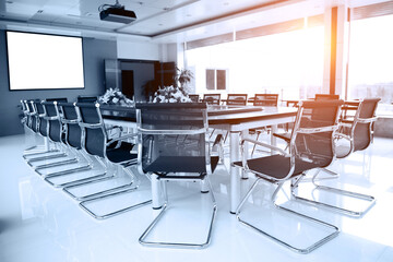Conference table and chairs in meeting room.