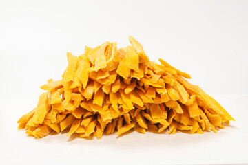 Dry tasty mango slices as a background.