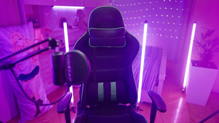Empty gaming chair in pink girl room with neon lights