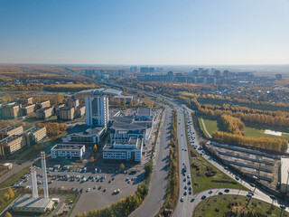 Top up aerial drone view of road and traffic in Kazan city during sunny day.