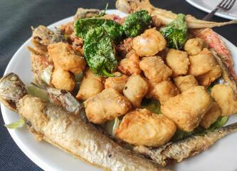 Delicious marinated fried fish , typical andalusian food.Spanish tapas with dogfish, anchovy red...