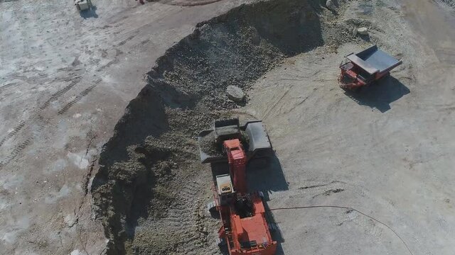 Aerial view of large mining vehicles at a mining quarry (China)