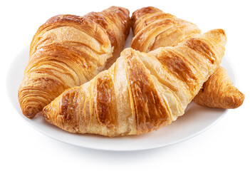 Tasty crusty croissants on the plate on white background. File contains clipping path.