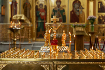 Burning candles on the background of the altar in an Orthodox church. Faith and Prayer.